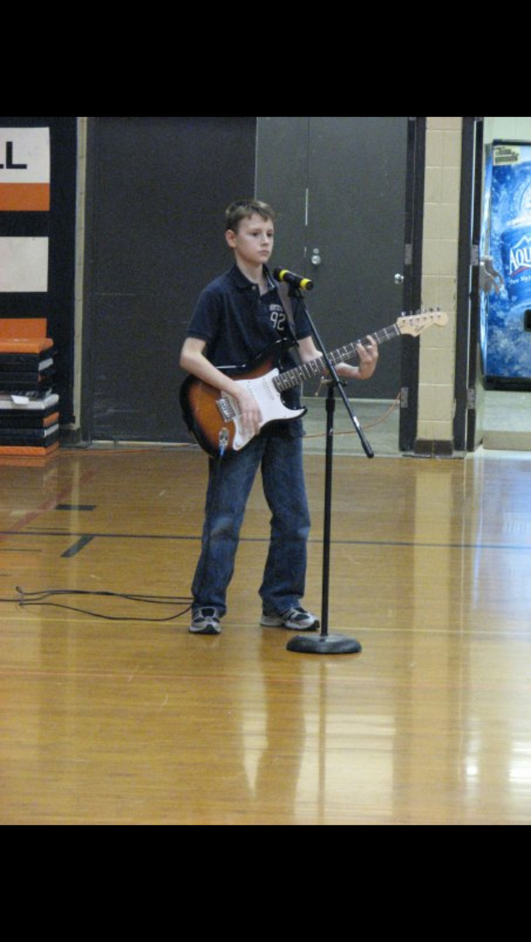 Randy playing guitar in middle school